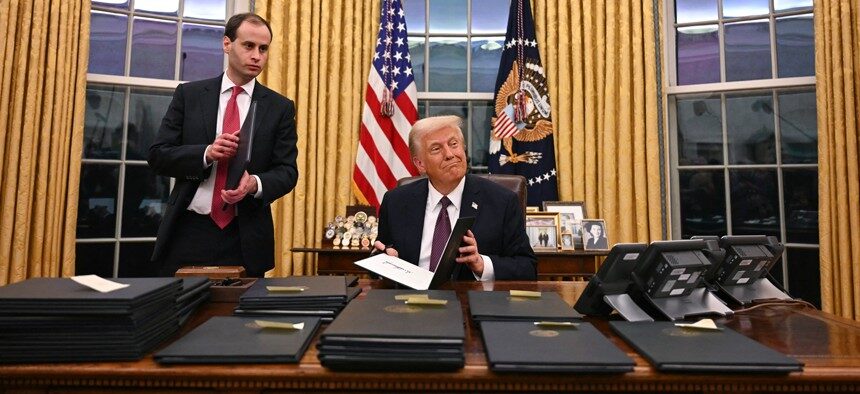 President Donald Trump signing executive orders